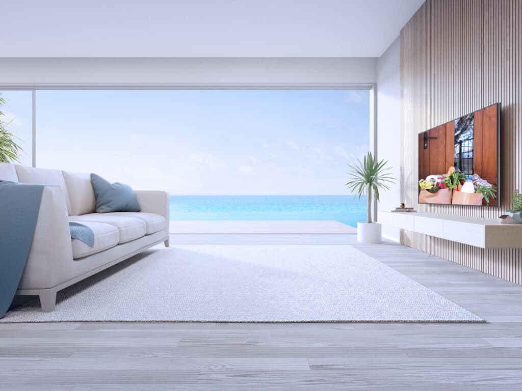 Image of a Connected TV on a living room showing grocries being delivered